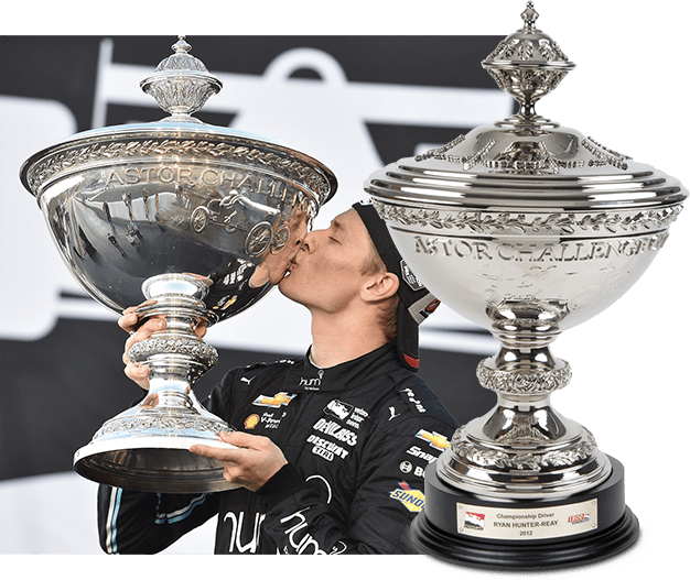 Josef Newgarden celebrating his Astor Cup victory Josef Newgarden kissing the Astor Cup