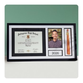 Grad holding Jostens class graduation keepsakes